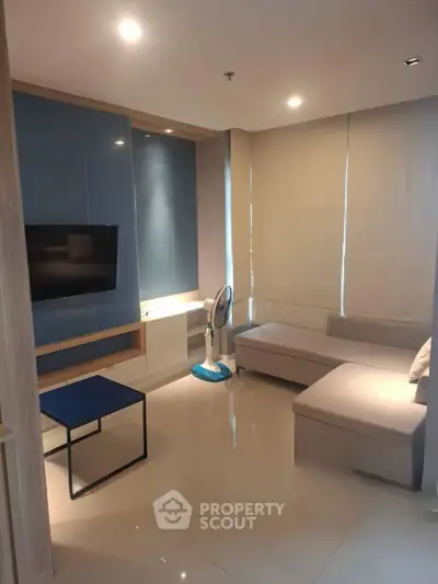 Modern living room with sleek design and cozy seating area