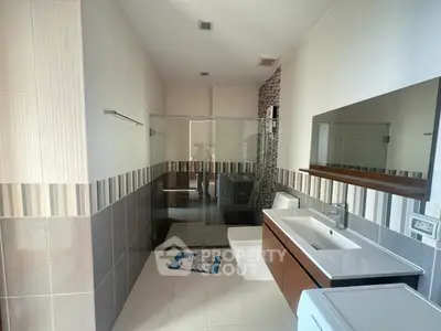 Modern bathroom with sleek design and glass shower enclosure