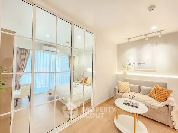 Bright and modern living room with glass partition and cozy decor