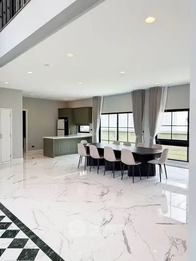 Spacious modern dining area with marble flooring and large windows