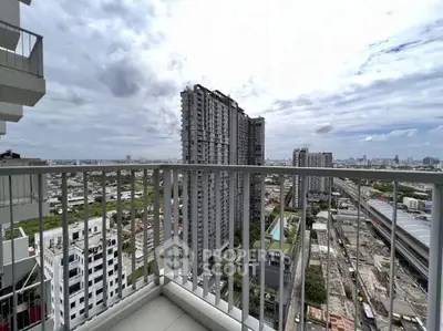 Stunning urban balcony view with city skyline and modern high-rise buildings.