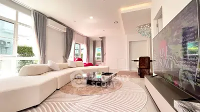 Luxurious modern living room with large windows and elegant decor