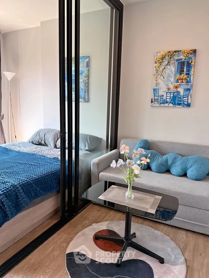 Modern studio apartment with cozy living area and stylish decor