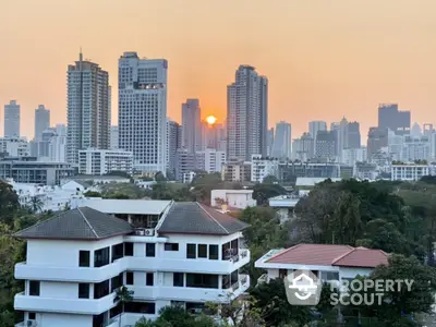 Stunning cityscape view with modern high-rise buildings at sunset, perfect for urban living enthusiasts.