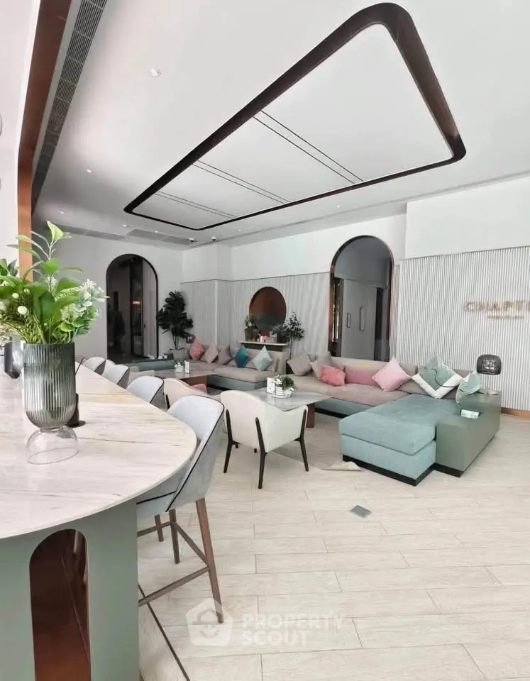 Spacious modern living room with stylish decor and open layout, perfect for entertaining guests.