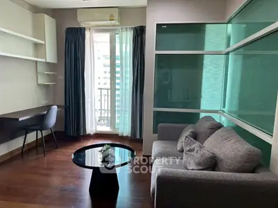 Modern living room with sleek furniture and balcony view