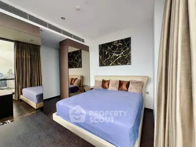 Luxurious bedroom with city view, elegant decor, and plush bedding in a high-rise apartment.