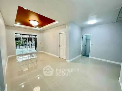 Spacious modern living room with glossy tiles and elegant lighting