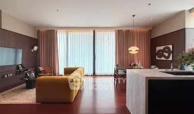 Luxurious modern living room with elegant decor and open kitchen layout, featuring a stylish yellow sofa and large windows.