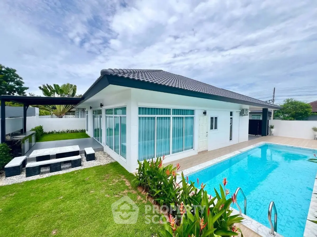 Stunning modern home with private pool and lush garden, perfect for luxury living.