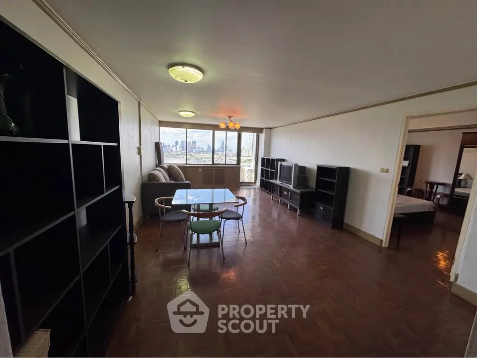 Spacious living room with city view, elegant dining area, and modern furnishings.