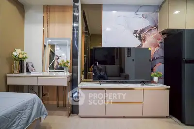 Modern living room with stylish decor and flat-screen TV