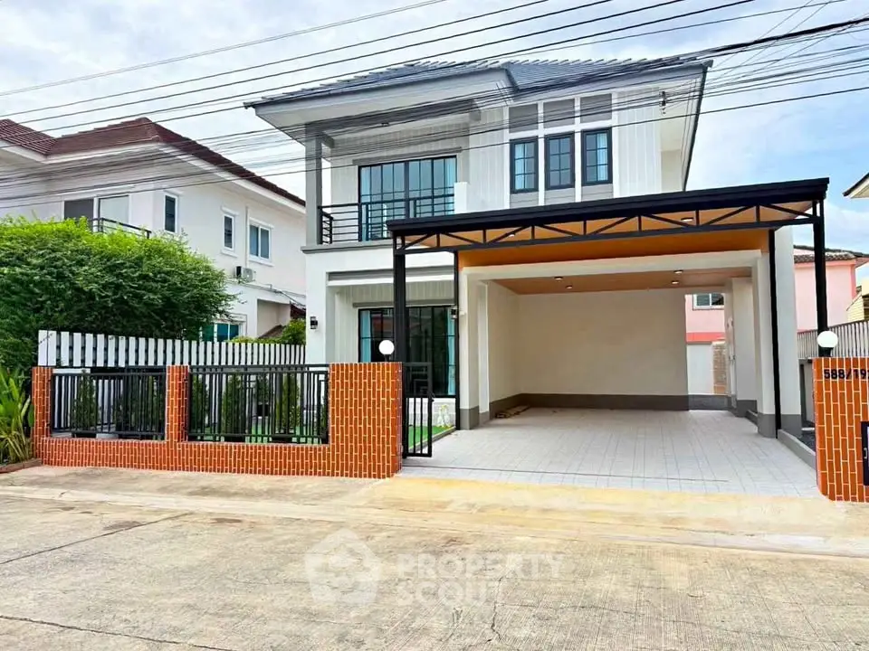 Modern two-story house with spacious driveway and stylish facade