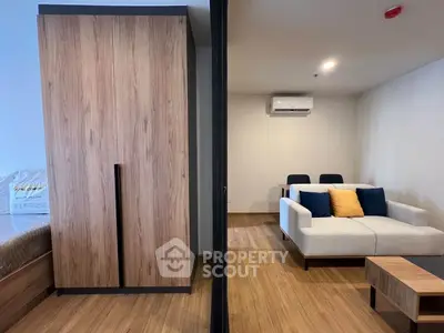 Modern living room with wooden flooring and sleek furniture design