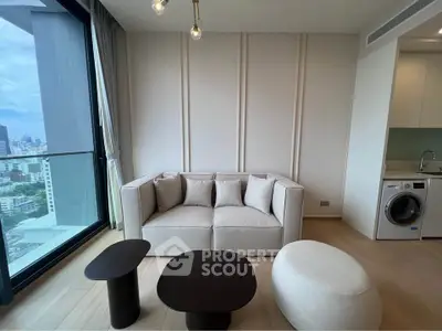 Modern living room with city view, featuring stylish furniture and in-unit washing machine.