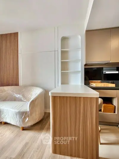 Modern living room with sleek wooden accents and cozy seating area