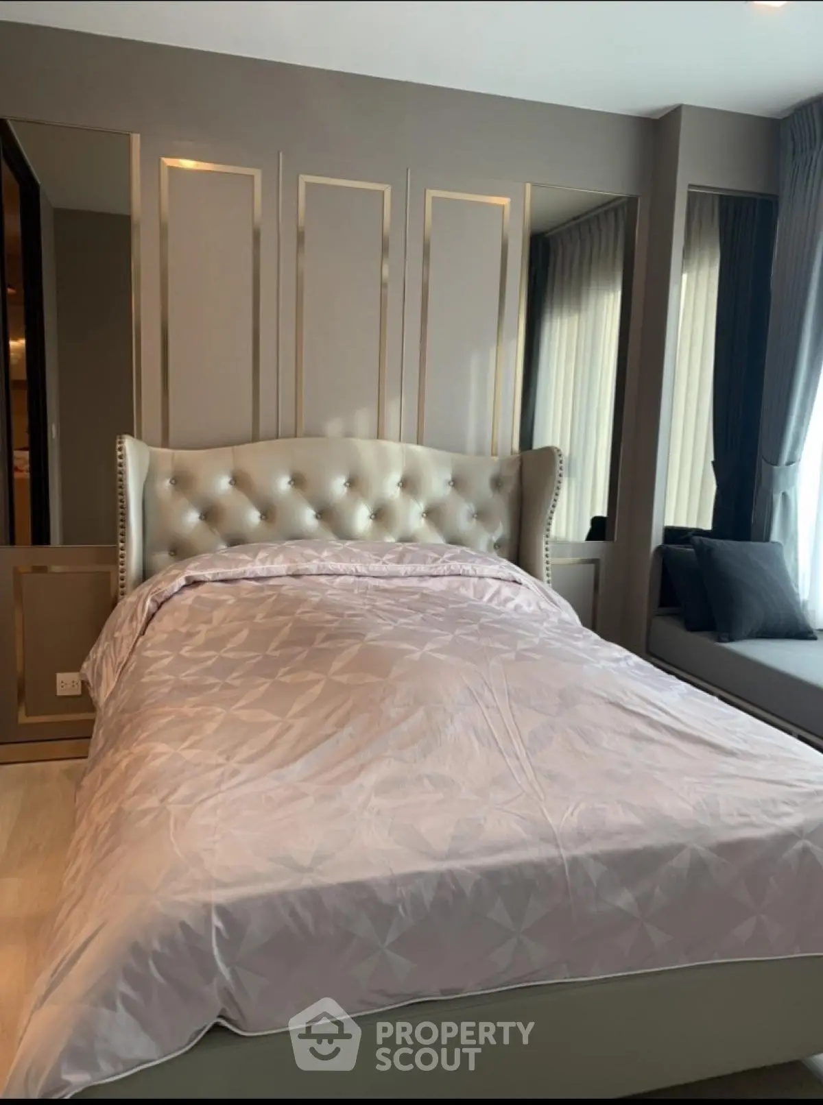 Luxurious bedroom with elegant tufted headboard and modern decor
