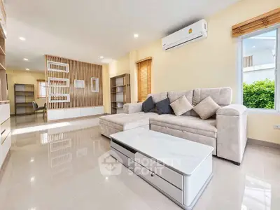Spacious modern living room with sleek furniture and natural light