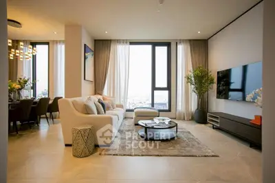 Luxurious living room with modern decor and stunning city view.