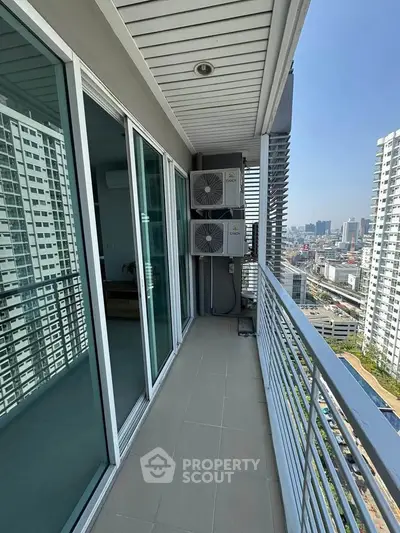 Spacious balcony with city view in modern high-rise apartment