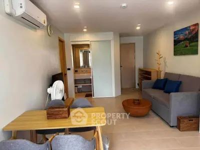 Modern living room with stylish furniture and air conditioning in a cozy apartment.