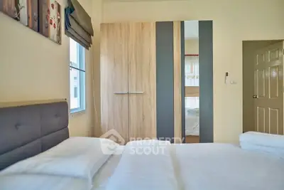 Cozy bedroom with modern wardrobe and soft lighting