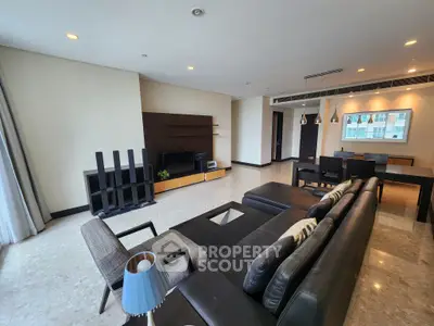 Spacious modern living room with sleek furniture and large windows