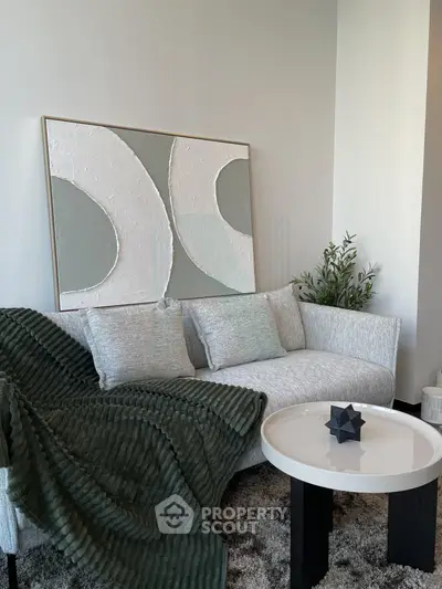Stylish modern living room with elegant decor and cozy seating area.