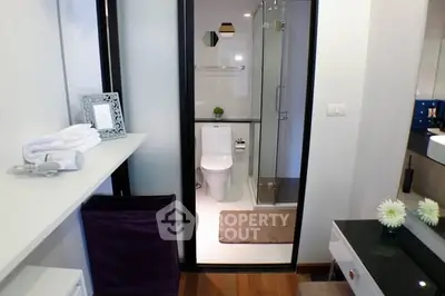 Modern bathroom with glass shower and elegant decor