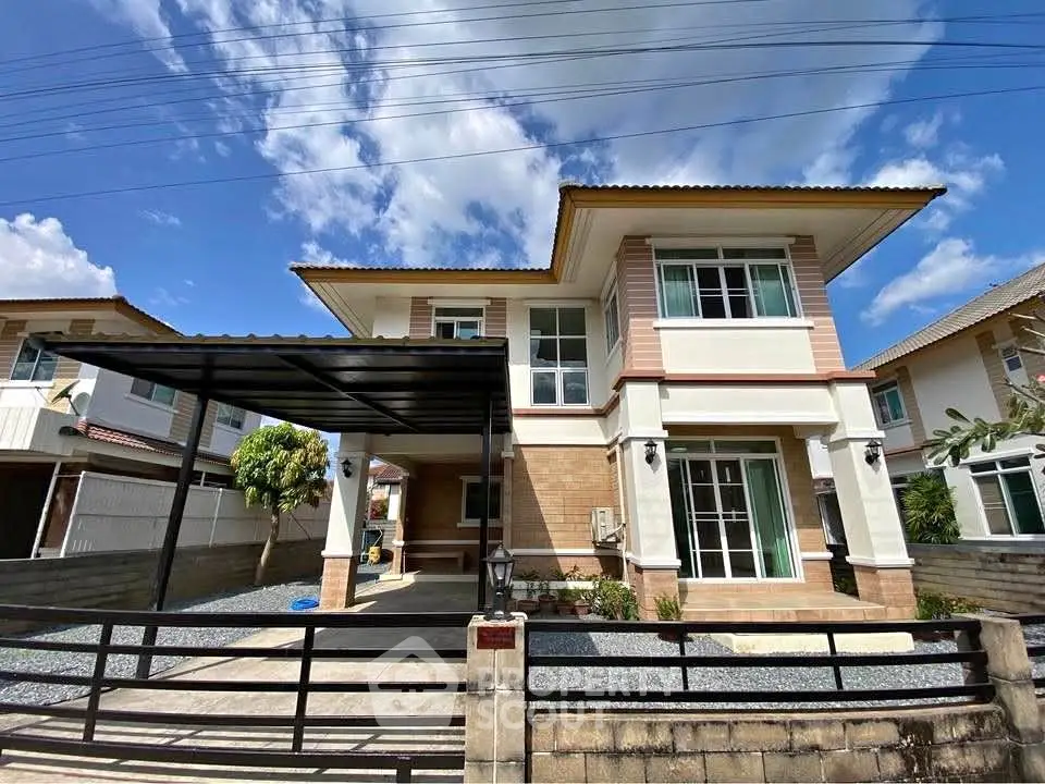 Stunning two-story modern house with spacious driveway and elegant facade under clear blue sky.