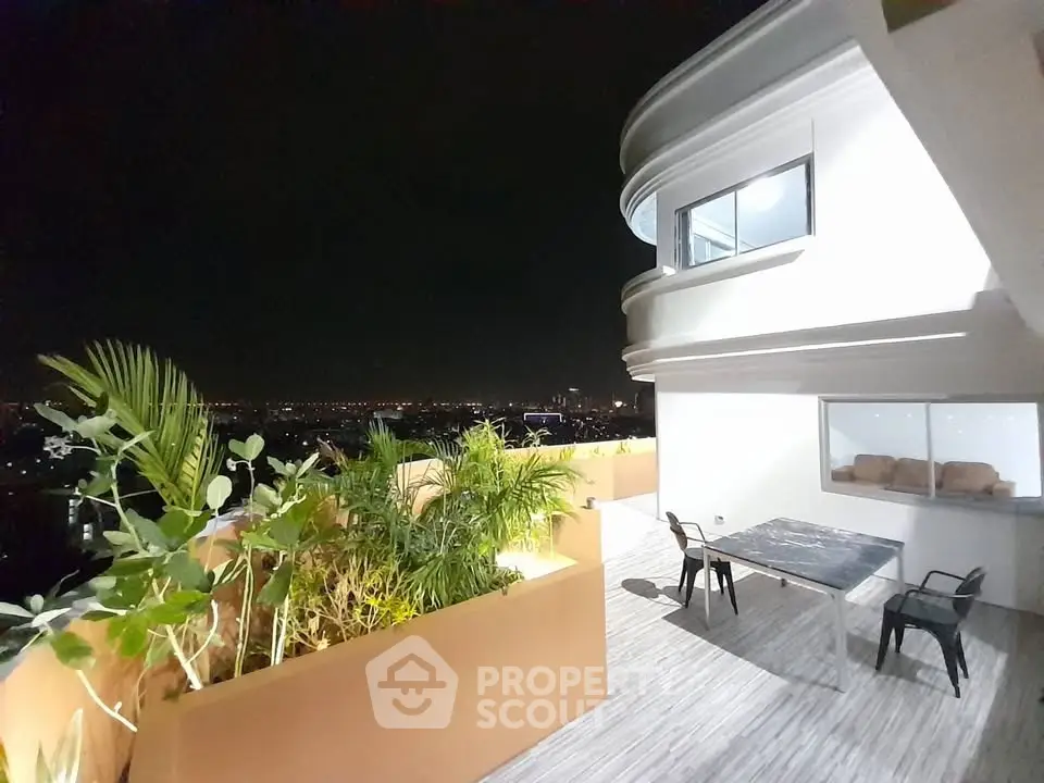 Stunning rooftop terrace with panoramic city views and modern outdoor seating.