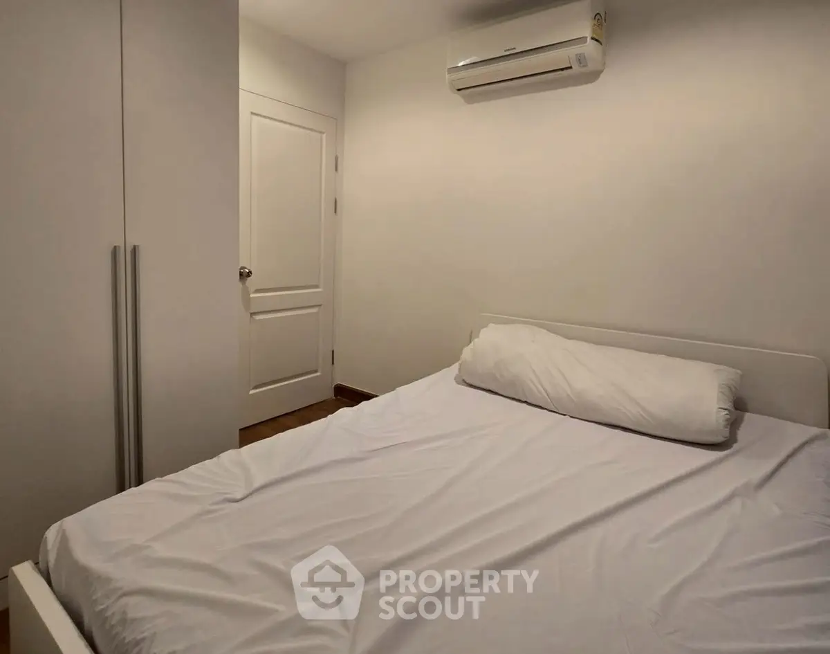 Cozy bedroom with air conditioning and minimalist design