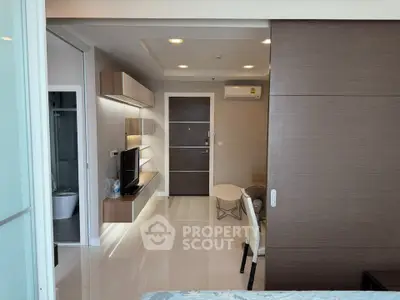Modern apartment interior with sleek design and open layout, featuring a stylish living area and contemporary furnishings.