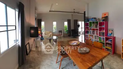 Spacious living room with modern decor and natural light