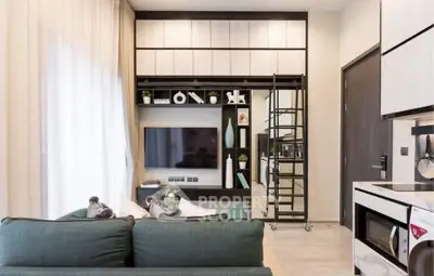 Modern living room with stylish decor and built-in shelving, featuring a cozy sofa and sleek entertainment center.