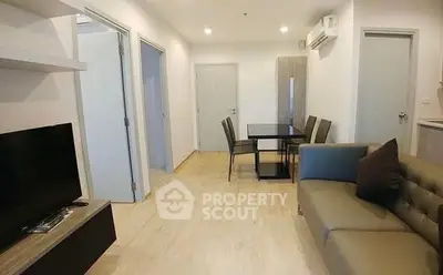 Modern living room with dining area and sleek furniture
