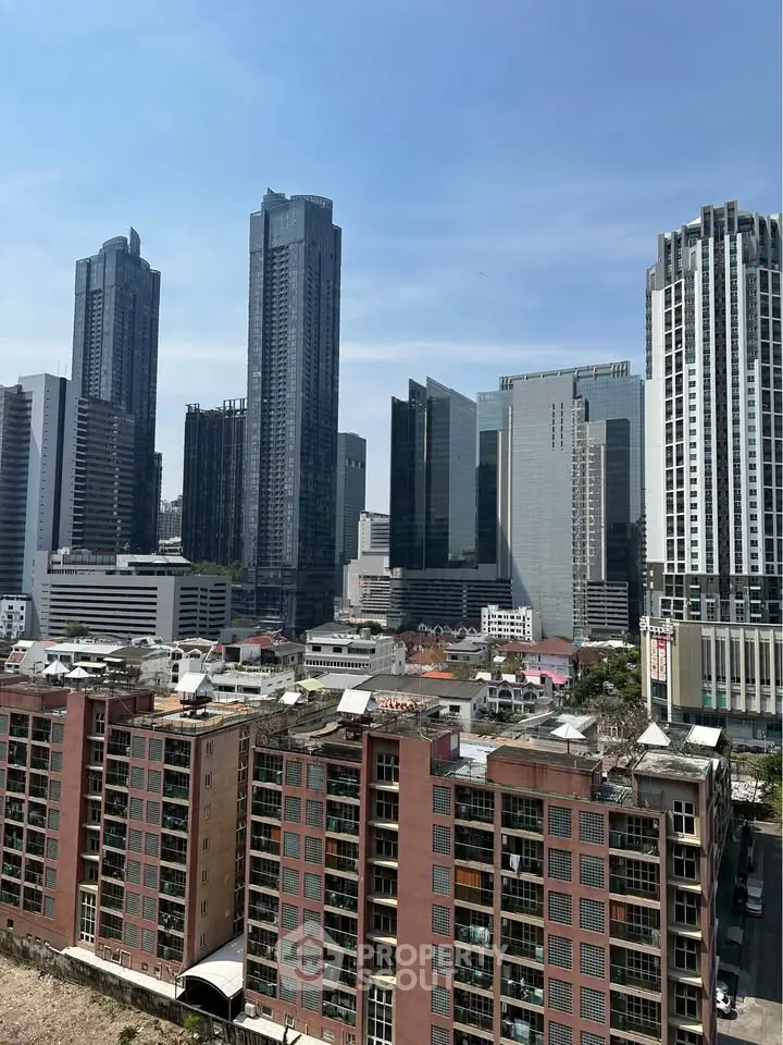 Stunning cityscape view showcasing modern skyscrapers and urban architecture under a clear blue sky.