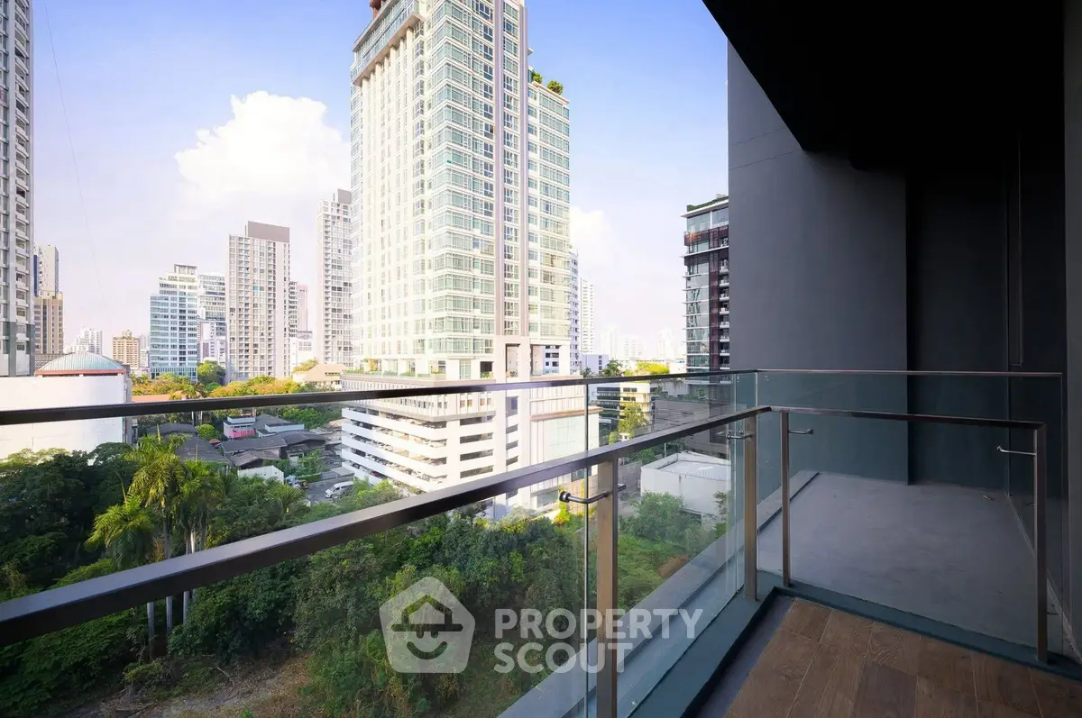 Stunning city view from a modern balcony in a high-rise building, perfect for urban living.