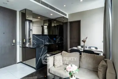 Luxurious modern living room with sleek kitchen and elegant dining area