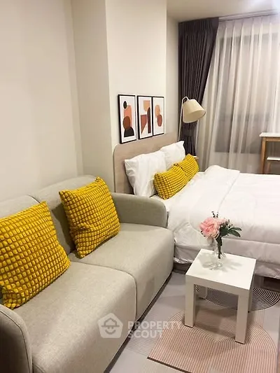 Cozy bedroom with stylish decor and comfortable seating area