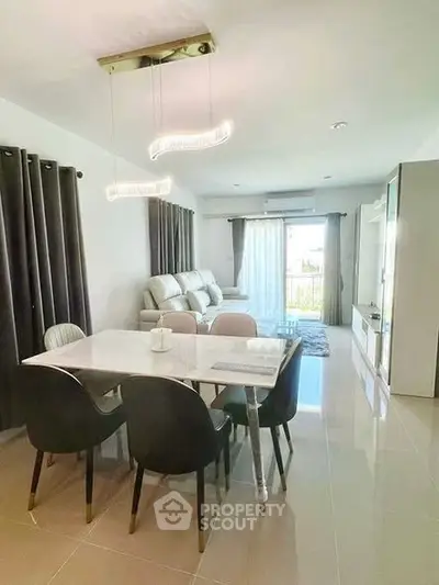 Modern living room with elegant dining area and natural light