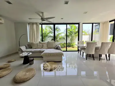 Spacious modern living room with garden view and elegant decor