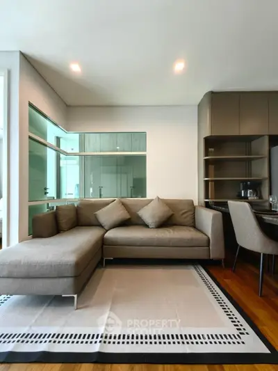 Modern living room with stylish gray sectional sofa and elegant decor