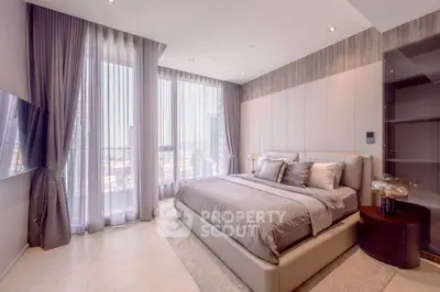 Luxurious bedroom with large windows and elegant decor in modern apartment