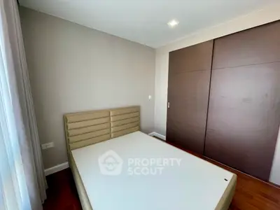 Modern bedroom with sleek wardrobe and stylish bedframe