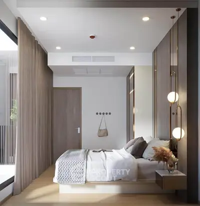 Modern bedroom with stylish decor and natural light, featuring a cozy bed and elegant lighting fixtures.