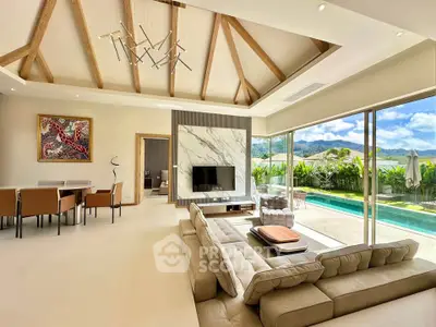 Luxurious living room with pool view and modern decor