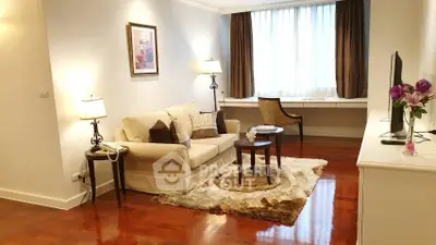 Elegant living room with cozy sofa, stylish decor, and natural light.