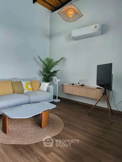 Modern living room with stylish decor and air conditioning