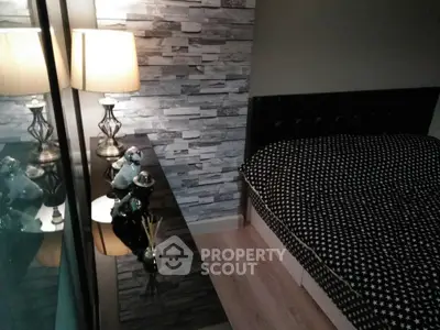 Cozy bedroom with modern decor and stylish stone accent wall